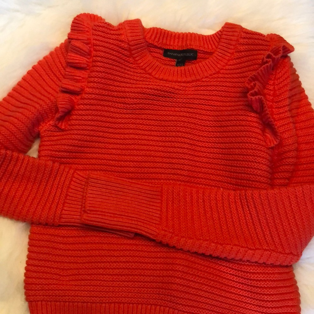 Bright orange sweater